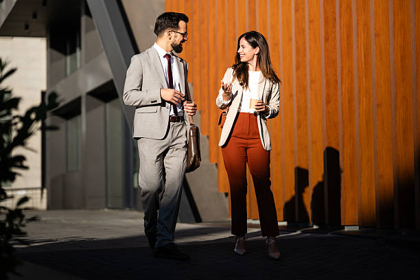 istock Business people walking and talking during coffee break 2233249803