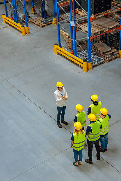 istock Top view of warehouse workers having a meeting 2233250125