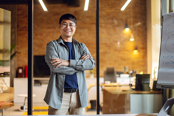 istock Business Professional Smiling Confidently Inside a Modern Office Environment 2233252480