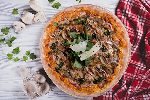 istock Freshly baked mushroom pizza on light background. 2233256717
