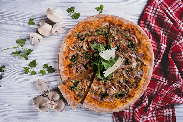 istock Freshly baked mushroom pizza on light background. 2233256825