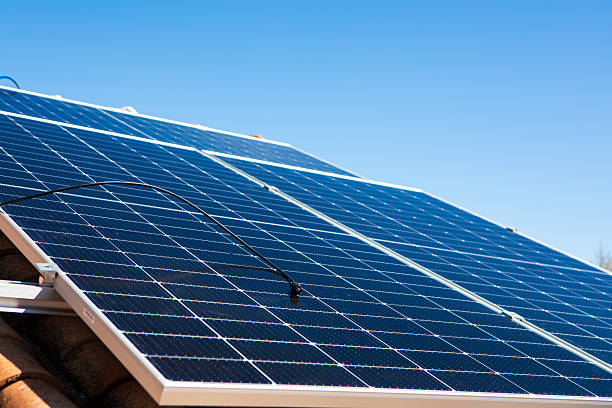 istock Solar panels installed on a rooftop in a sunny environment, demonstrating renewable energy usage for residential power needs 2233257429