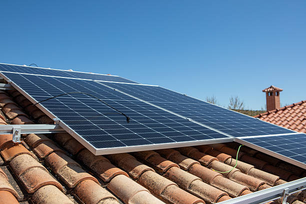 istock Solar panels installed on a rooftop in a sunny environment, demonstrating renewable energy usage for residential power needs 2233257431