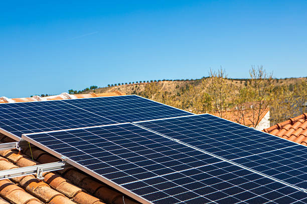 istock Solar panels installed on a rooftop in a sunny environment, demonstrating renewable energy usage for residential power needs 2233257559