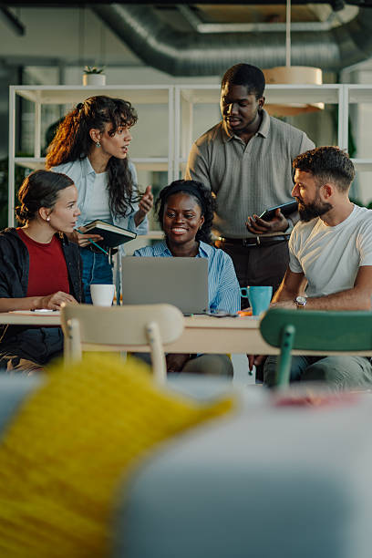 istock Diverse business team collaborating on a project using laptop in modern office 2233257668
