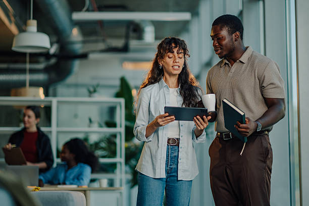 istock Business colleagues collaborating, sharing ideas in modern office 2233257761