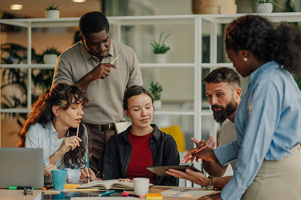 istock Diverse business team collaborating on project in modern office 2233257819