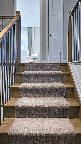 istock Elegant staircase with soft carpet leading to a bright room, showcasing modern design elements and inviting atmosphere for home interiors 2233260438