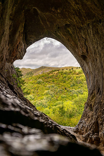 istock Discovering breathtaking landscape through cave opening in the Balkans 2233261340