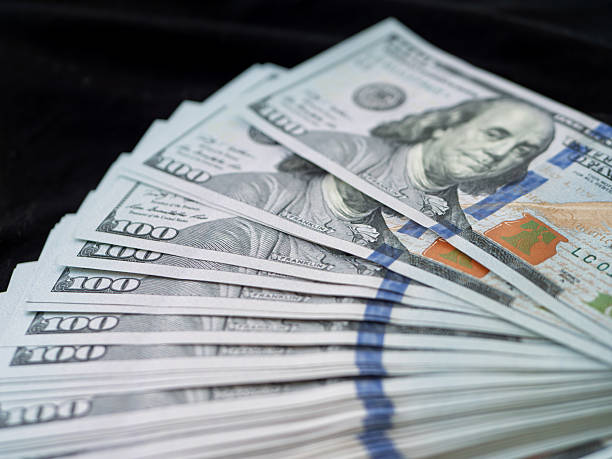 istock Creative Representation of Stacked US Dollar Bills 2233262264