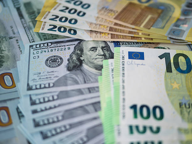 istock Assorted Currency Notes: 100 Euro and 200 Dollar Bills 2233262361