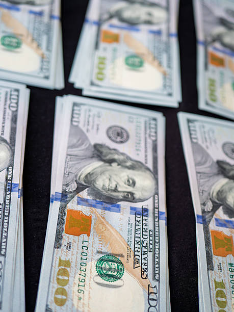 istock Stacks of U.S. Hundred Dollar Bills Arranged Neatly 2233262389