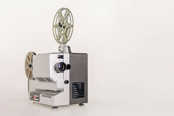 Close-up of a vintage movie projector, highlighting its aged condition and intricate details