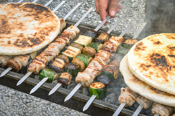 Various vegetables on skewers with small pieces of kebab