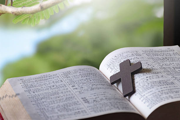 istock Wooden cross rosary on bible 2233263765