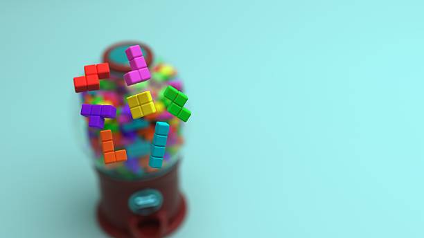 istock Tetromino blocks in front of a gumball machine with a sphere container filled with blocks on a surface 2233263999