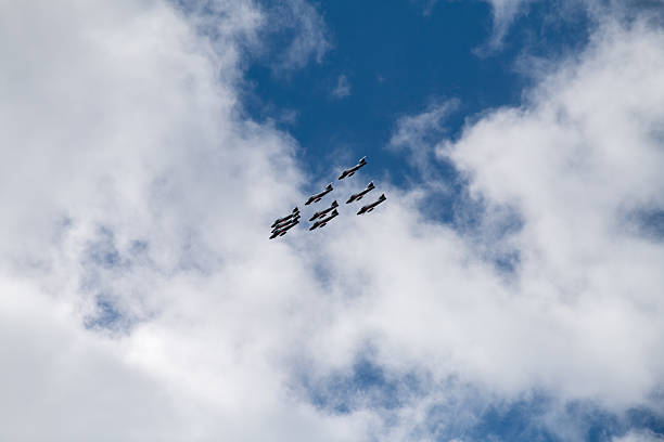 The Royal Canadian Air Force Snowbirds Demonstration Team fly in a delta formation during the 2025 Canadian International Air Show in Toronto, Canada. Nine CT-114 Tutor aircraft performed synchronized aerobatic maneuvers over Lake Ontario as part of the annual Labour Day weekend event.