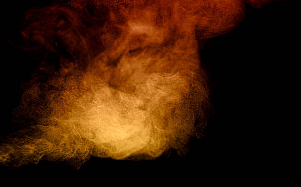 istock Orange and yellow smoke cloud on dark background with abstract texture and dramatic effect, ideal for fire, explosion, Halloween, energy, or creative artistic design projects. 2233267589