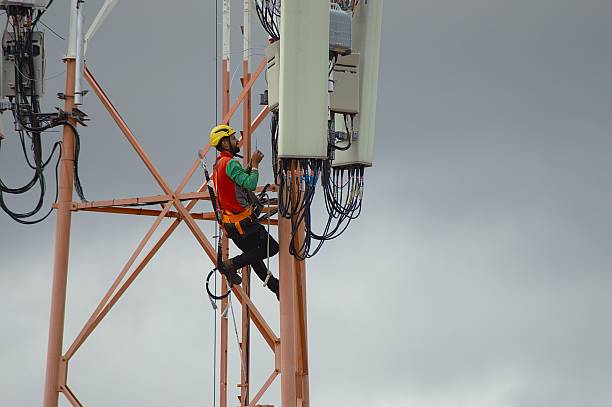 istock Communication technician inspects antenna system during height work in Brazil 2233270216