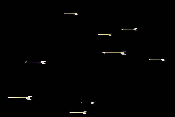 A detail shot of precision archery in action, showcasing arrows in mid-flight toward a vibrant target. The blurred background emphasizes speed and focus, highlighting the sport's technical skill and concentration required for accuracy. Perfect for archery enthusiasts and sports training imagery.