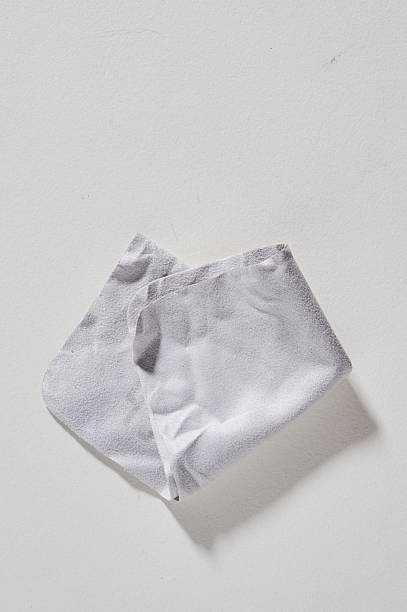 istock A single crumpled paper tissue is shown against a white background with a shadow cast by the object 2233273836