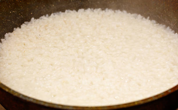 istock Pan of rice is cooking in a pan 2233277622