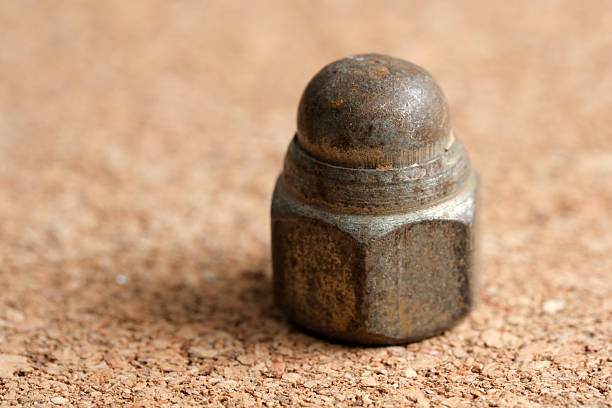 istock Rusty metal cap resting on a textured surface in soft natural light 2233277999