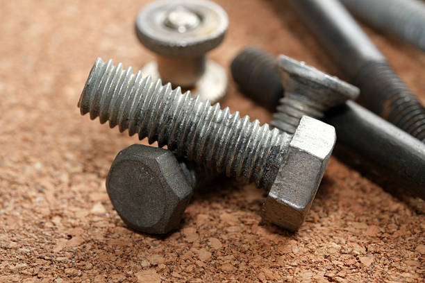 istock Industrial fasteners arranged on a textured cork surface for assembly 2233278063