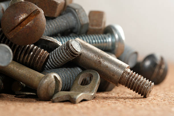 istock Collection of various metallic fasteners arranged neatly on a surface 2233278101