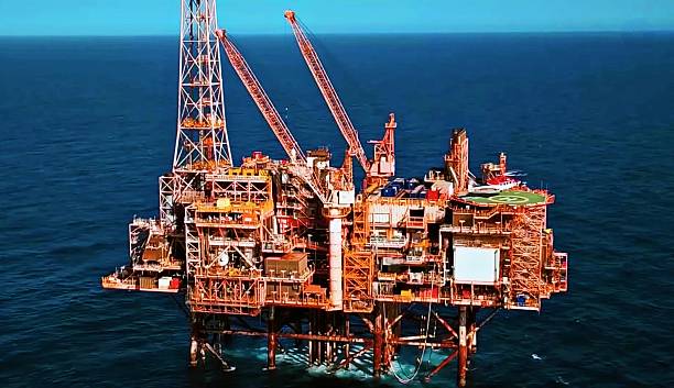 istock Massive Offshore Oil Rig Platform in Open Sea – Petroleum Industry Energy Infrastructure 2233278497
