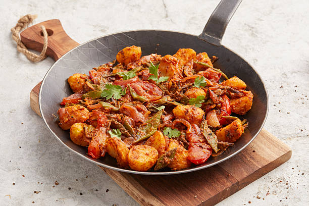 istock Indian-style potatoes and coco beans 2233282471