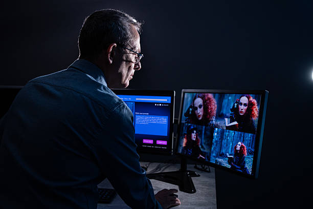 Male IT engineer doing maintenance on artificial intelligence systems. Senior male website designer, generates an image with artificial intelligence (AI) and creates a prompt