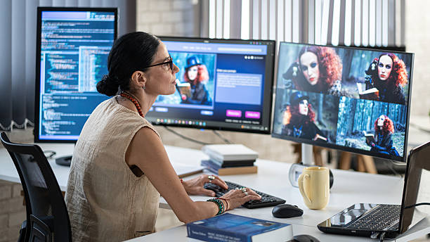 Female IT engineer doing maintenance on artificial intelligence systems. Senior female website designer, generates an image with artificial intelligence (AI) and creates a prompt