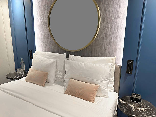 istock Comfortable bed with clean linens in hotel room 2233284876