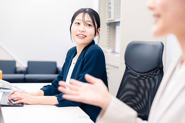 istock Young woman working at a desk in an office 2233286520