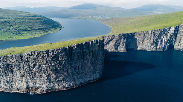 istock Explore breathtaking cliffs and serene waters of Faroe Islands during a tranquil summer afternoon 2233288520