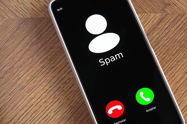 istock Incoming spam call on mobile phone on table 2233289375