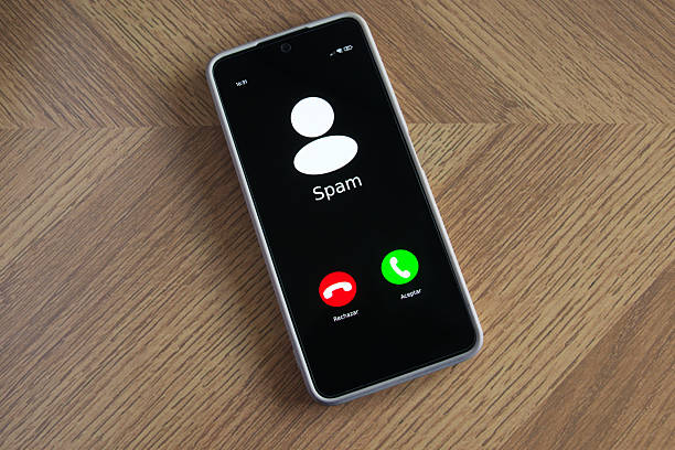 istock Incoming spam call on mobile phone on table 2233289383