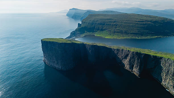 istock Stunning coastal cliffs of the Faroe Islands under a tranquil sky 2233289582