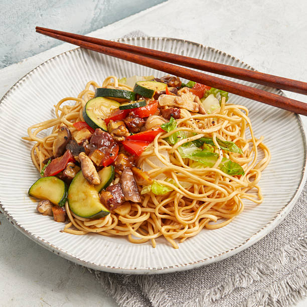 istock Asian noodle stir-fry with tofu 2233289812