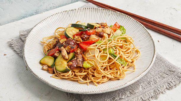 istock Asian noodle stir-fry with tofu 2233289840