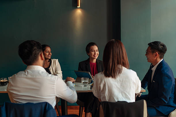 istock Diverse and multiracial Asian team working during business lunch 2233291025