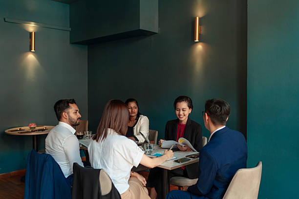 istock Diverse and multiracial Asian team working during business lunch 2233291030