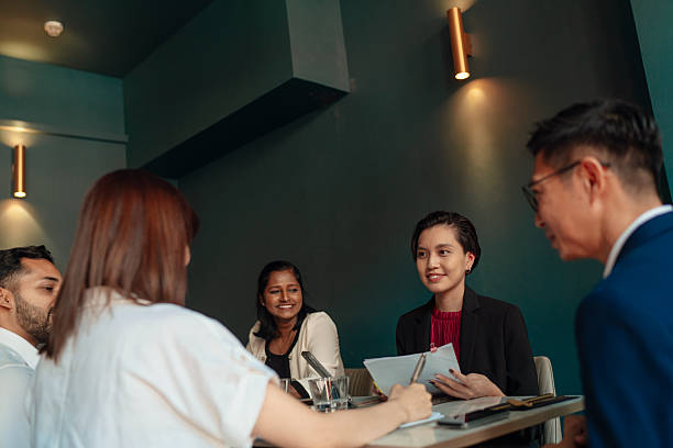 istock Diverse and multiracial Asian team working during business lunch 2233291045
