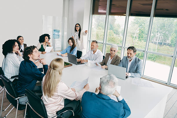 istock Professional team collaborating during an office meeting focused on project strategies with colleagues in a modern workplace 2233293139