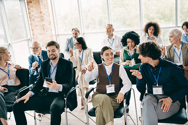 istock Diverse group of professionals engaging in productive discussions during an indoor business conference in a modern office setting. 2233293293