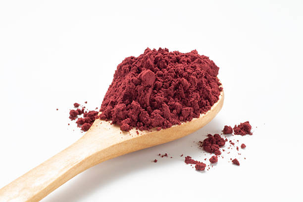 istock Red yeast rice powder in wooden spoon 2233294922