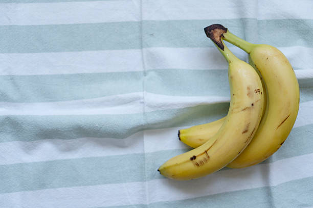 Striped tablecloth and bananas