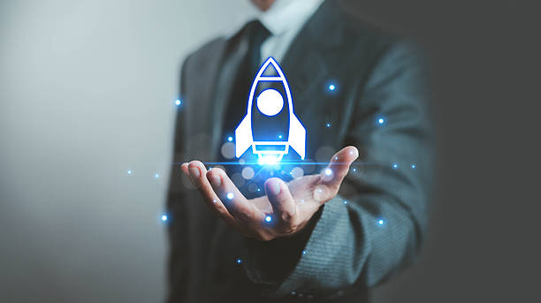 istock Businessman holding glowing blue rocket hologram, representing startup growth, technology innovation, futuristic digital strategy, leadership vision, and successful business launch concept. 2233297217