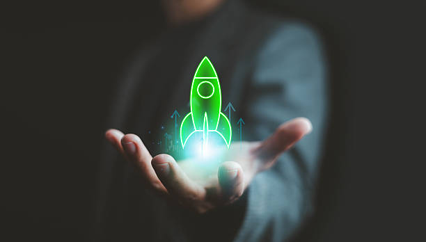 istock Futuristic green rocket icon hovering above a businessman's hand, symbolizing startup growth, innovation, technology success, and business launch strategy with modern digital concept. 2233297218